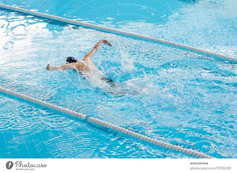 Man swimming in pool, blue water man adult sport one person action underwater athlete male indoors lane swimwear people health activity lifestyle healthy