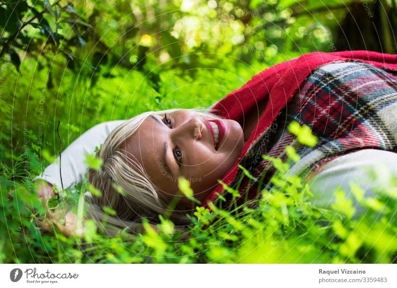 Portrait of a woman among the grass. Happy Beautiful Relaxation Summer Human being Woman Adults 1 18 - 30 years Youth (Young adults) Nature Spring