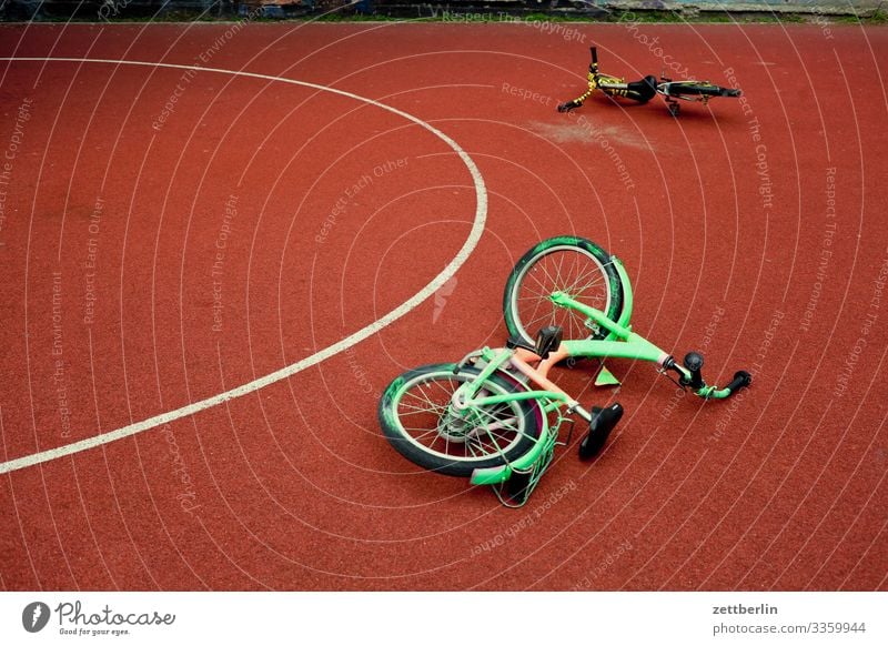 Two bicycles Bicycle Cycling tour Wheel Kiddy bike Playing Playground 2 In pairs Lie Basketball Playing field Circle Semicircle Berlin City Life Schöneberg Town