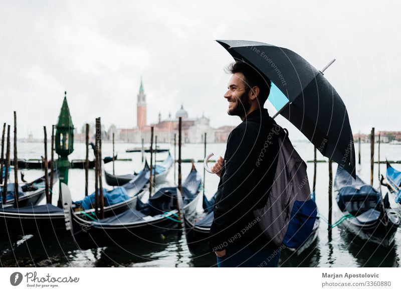 Young traveler in Venice, Italy on a rainy day Lifestyle Vacation & Travel Tourism Trip Sightseeing City trip Human being Masculine Young man