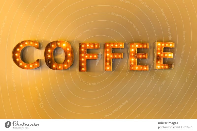 Encased letter lights yellow wall reading coffee Beverage Hot drink Coffee Espresso Style Design Joy Lamp Night life Signage Warning sign Glittering Bright