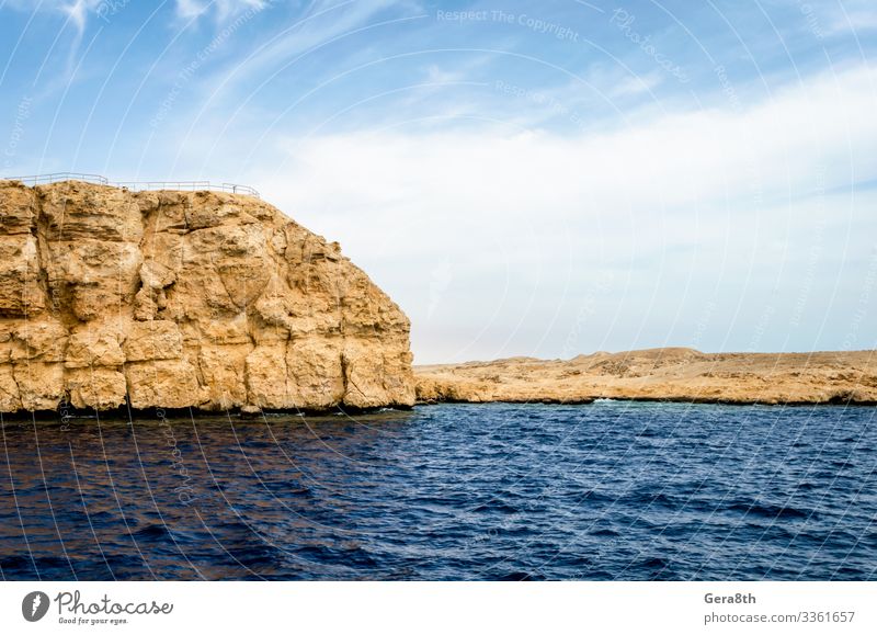 rocky coast of the Red Sea andblue sky with clouds Exotic Vacation & Travel Tourism Trip Summer Ocean Island Nature Landscape Sand Sky Clouds Horizon Climate
