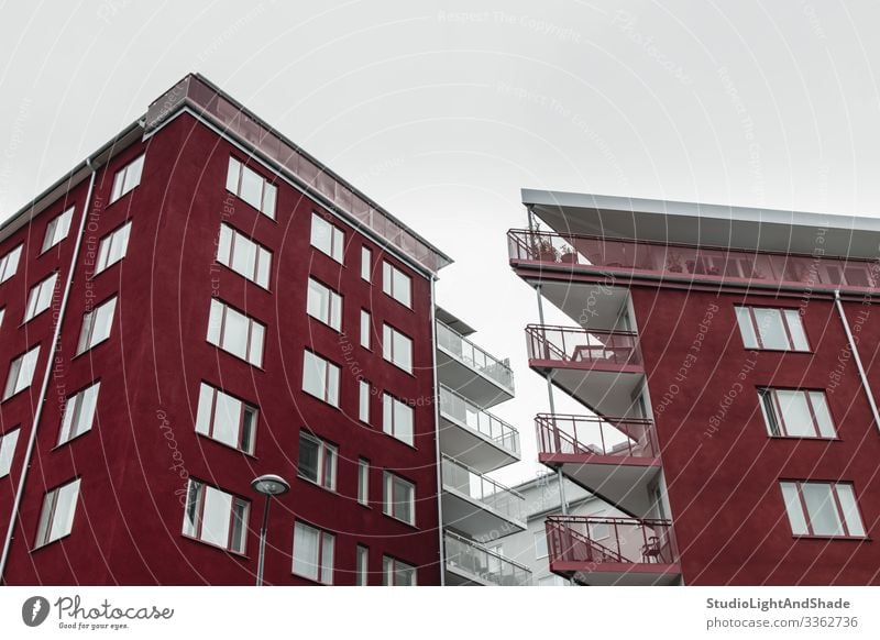 Corners of modern dark red buildings Lifestyle House (Residential Structure) Sky Clouds Town Building Architecture Facade Balcony Street Dark Simple Modern New