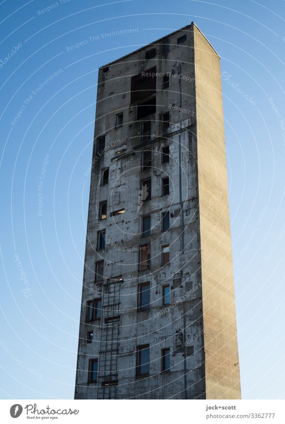 Unusual tower like no other, rising before a cloudless sky Tower Architecture Tall lost places Sunlight Silhouette Neutral Background Remainder Ravages of time