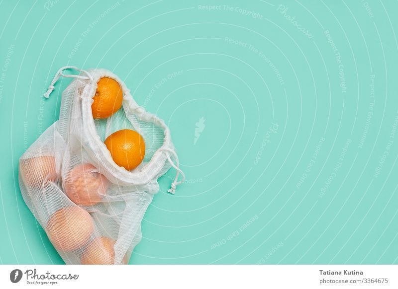 Zero waste concept. Tangerines in the package. Copyspace. Fruit Rope Packaging String Fresh Bright Natural Above Green Creativity Environmental pollution