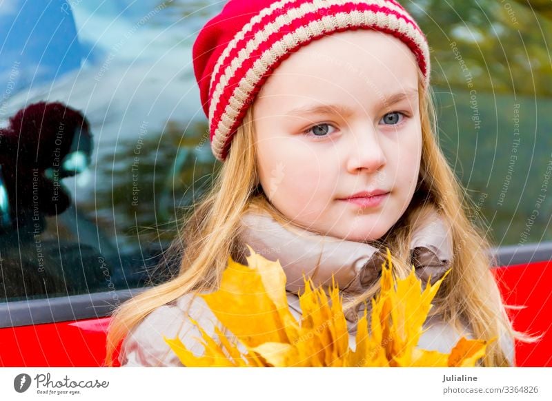 Cute girl in red hat Child Schoolchild Woman Adults Infancy Autumn Hat Blonde Smiling Blue Red White Emotions kid preschooler one Lady six 7 Caucasian European