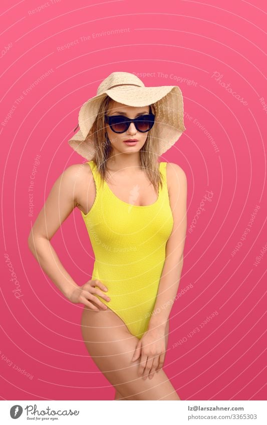 Trendy young woman in a yellow swimsuit Lifestyle Body Skin Relaxation Vacation & Travel Tourism Summer Sunbathing Woman Adults Hand 1 Human being 18 - 30 years