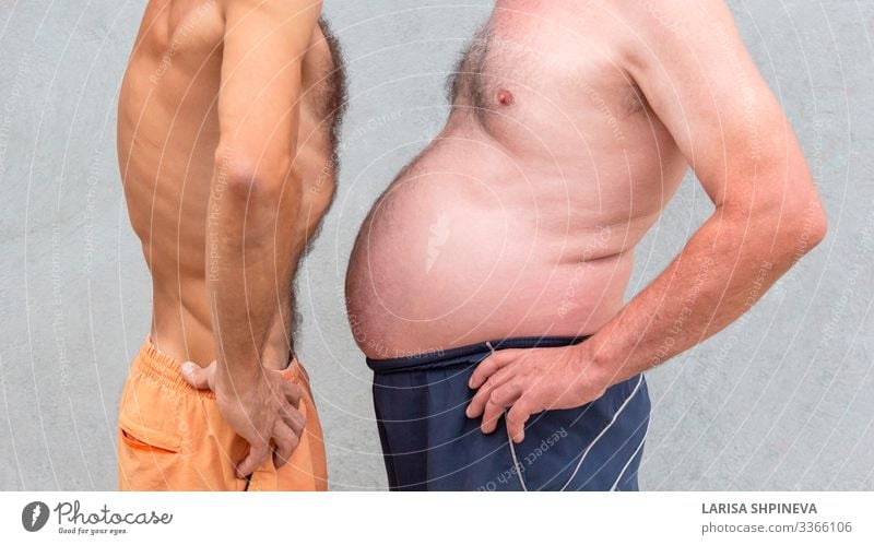 Two naked men comparing belly Diet Beer Lifestyle Body Wellness Sports Success Human being Man Adults Fitness Thin Large Lose overweight Waist fat care health