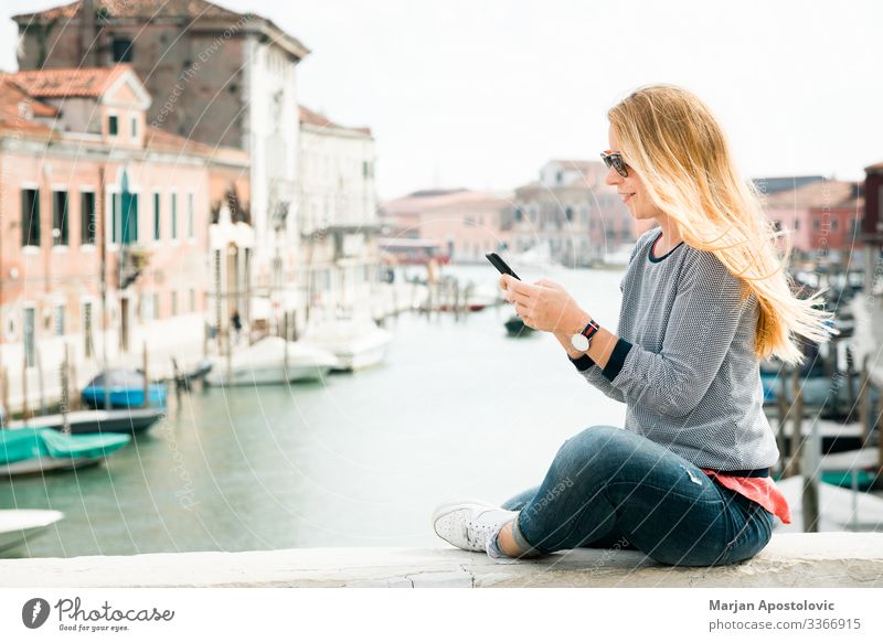 Young woman using smartphone on the bridge in Venice, Italy Lifestyle Vacation & Travel Tourism Trip Sightseeing City trip Cellphone Human being Feminine