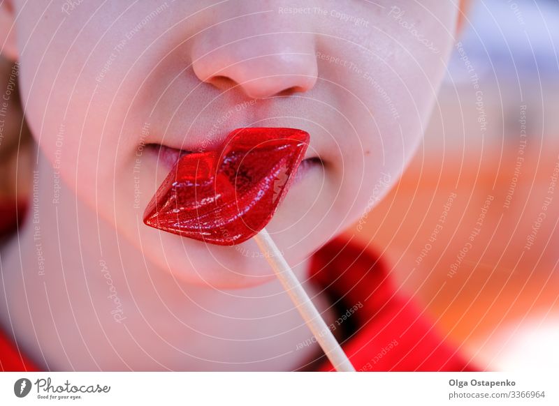 Girl kisses a lip shaped lollipop Heart Beautiful Love Kissing Youth (Young adults) Red Candy Lollipop Woman Beauty Photography Sweet Happy Day Delicious Food