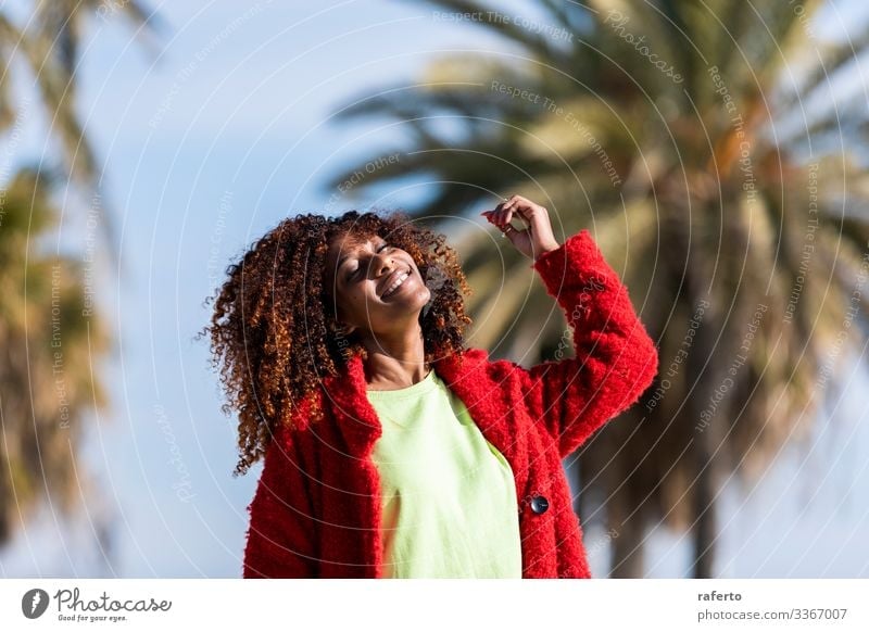 Portrait of a beautiful afro american woman standing in the street in a sunny day Lifestyle Happy Beautiful Face Vacation & Travel Human being Feminine