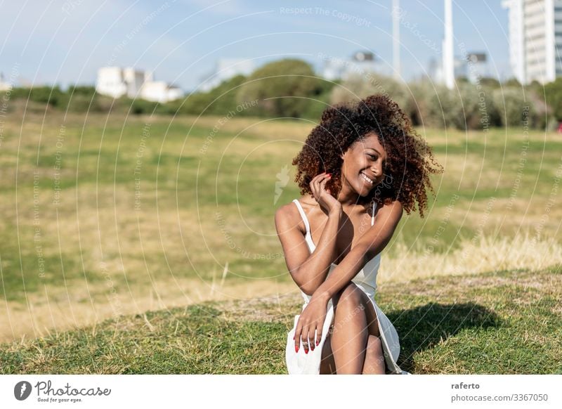 afro american woman with white dress sitting on grass Lifestyle Style Beautiful Face Human being Feminine Young woman Youth (Young adults) Woman Adults 1