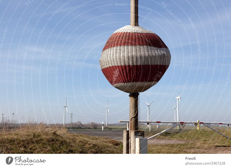 helpful |Signalball Landscape Field Meadow Bushes Sky cirrostratus clouds snow fence Street windmills Electricity pylon Energy Cables Control barrier