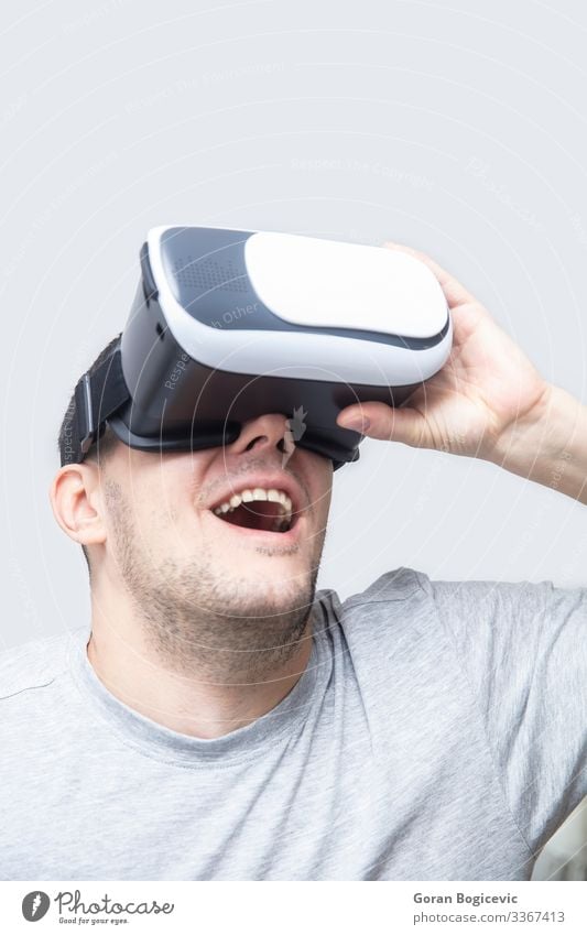 Young man using vr headset, experiencing virtual reality Leisure and hobbies Playing Entertainment Headset Technology Human being Youth (Young adults) Man