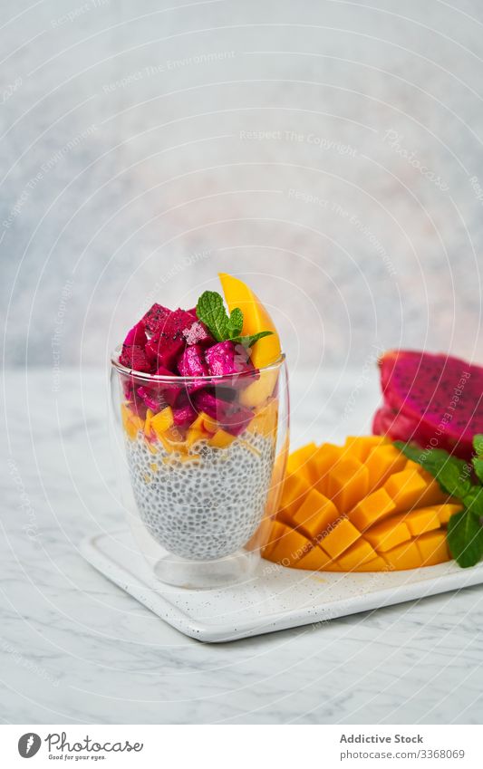 Delicious fruit dessert in glass pudding super food clean eating restaurant chia pitaya colorful red mango mint dish fresh delicious high cuisine exotic