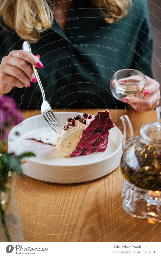 Woman eating berry cake and drinking tea dessert pie sweet woman plate fork red pastry food gourmet female tasty delicious fresh bakery table fruit cuisine