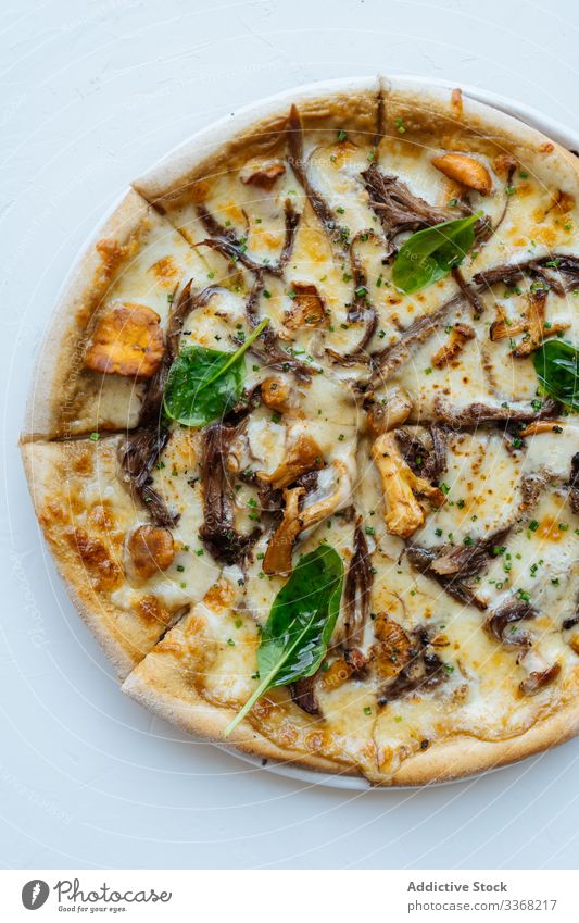 Seafood sliced pizza with mushrooms and basil seafood cheese dish tasty portion try warm hot piece herb ingredient recipe baked roasted fried prepared fresh