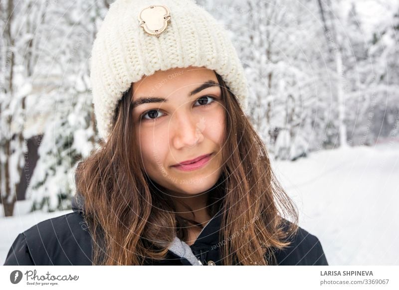 Portrait of woman in knitted hat on snowy forest in winter Lifestyle Joy Happy Beautiful Face Leisure and hobbies Winter Snow Human being Woman Adults Nature
