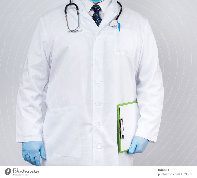 male doctor in a white coat Health care Medical treatment Medication Work and employment Doctor Hospital Human being Man Adults Hand Tie Gloves Paper Stand Blue