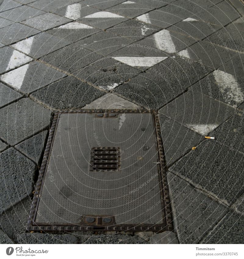 Tangram failed attempts tangram walkway slabs Manhole cover Concrete Metal Cigarette Butt Gray White lines Deserted Black Sidewalk