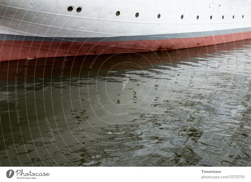 Many eyes look at the water ship Hull Porthole Baltic Sea Water reflection Reflection in the water Calm