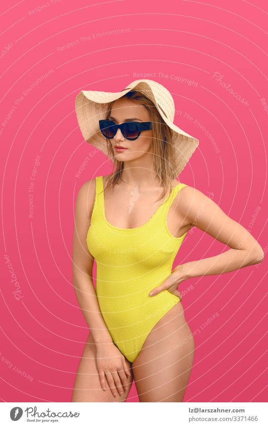 Trendy young woman in a yellow swimsuit Lifestyle Body Skin Relaxation Vacation & Travel Tourism Summer Sunbathing Woman Adults 1 Human being 18 - 30 years