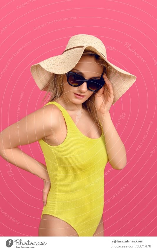 Trendy young woman in a yellow swimsuit Lifestyle Body Skin Relaxation Vacation & Travel Tourism Summer Sunbathing Woman Adults 1 Human being 18 - 30 years