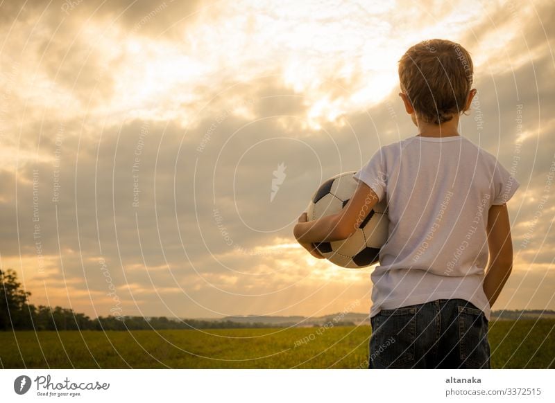 Portrait of a young boy with soccer ball. Concept of sport. Lifestyle Joy Happy Relaxation Leisure and hobbies Playing Summer Sports Soccer Child Human being