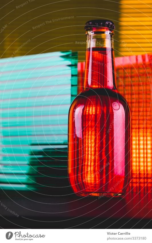 A bottle with different colors lights. Beverage Drinking Cold drink Bottle Esthetic Bright Trade Colour photo Studio shot Close-up Detail Deserted