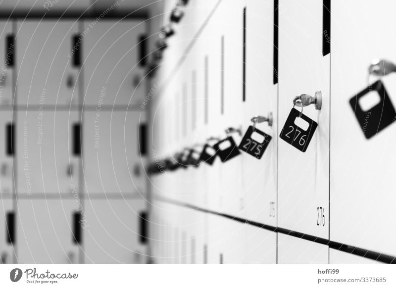 Lockers with selective focus on a key Lockbox Interior shot doors Safety Modern Symmetry Theatre cloakroom lockers Key Closed Storage compartment