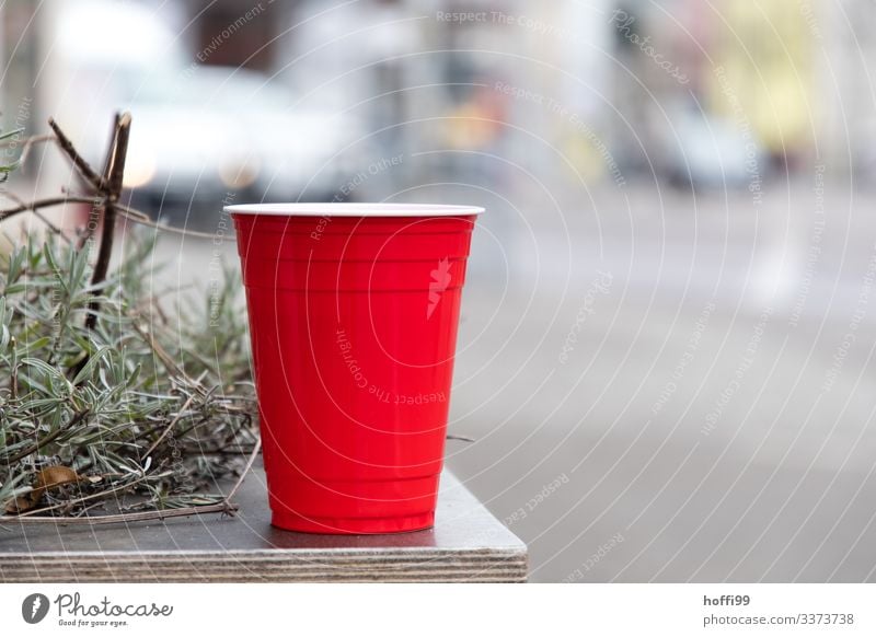 red plastic cup with rosemary on a table Red red cup Plastic cup Trash plastic waste environmental impact Isolated Image Rosemary selective focus
