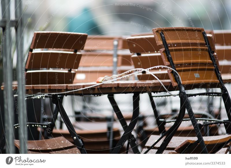 connected chairs and table in the rain Chair minimalism Minimalistic Folding chair Group of chairs Stack Stack of chairs Steel Modern Gloomy Gray Clean