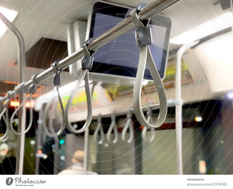A row of gray bus handles Contentment Vacation & Travel Tourism Trip Transport Public transit Vehicle Railroad Underground Tram Metal Steel Plastic Hang Stand