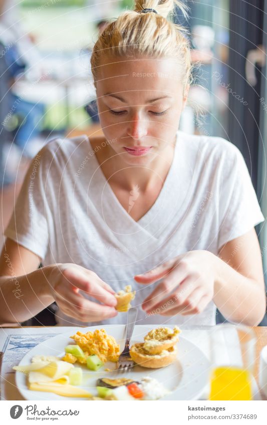 Woman eating delicious healthy breakfast. Cheese Vegetable Bread Eating Breakfast Juice Beautiful Vacation & Travel Tourism Restaurant Adults Hand Street