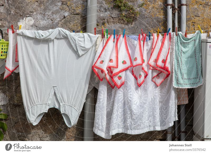 washing day Clothesline Washing day mossy house wall Portugal Handkerchief Home country Folklore at home Clean Mom Fabric softener White tex†ilen Clothes peg