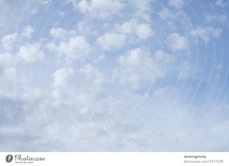 Bright white blue rain clouds with view into the higher atmosphere at dusk. Blue and white atmosphere. Environment Nature Landscape Air Water Sky Sky only