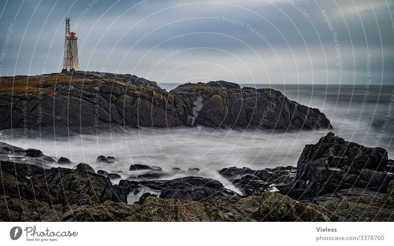 Lighthouse and transmitter mast on the stormy coast Iceland Coast Rock long-term exposure Gale Waves curt Clouds Discover