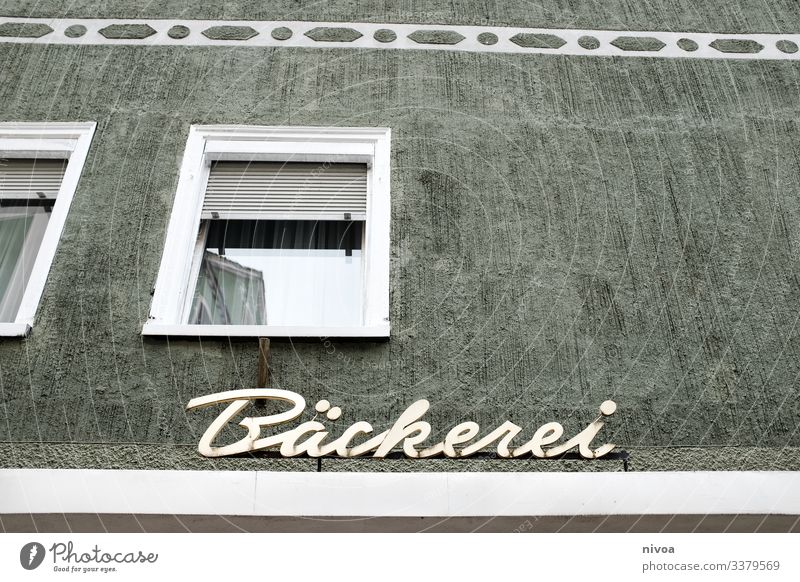 Facade of a bakery Bakery House (Residential Structure) Window pane Landscape format Paintwork Colour Lettering writing Signs and labeling Allgäu Roll Eating