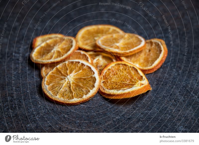 dried orange slices on worktop Orange Kitchen Dry Dried fruits Lie Table Dark stone texture Christmas