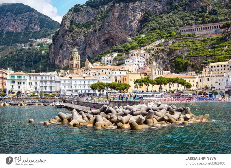 Aerial view of small haven of Amalfi village with turquoise sea and colorful houses on slopes of Amalfi Coast with Gulf of Salerno, Campania, Italy. amalfi