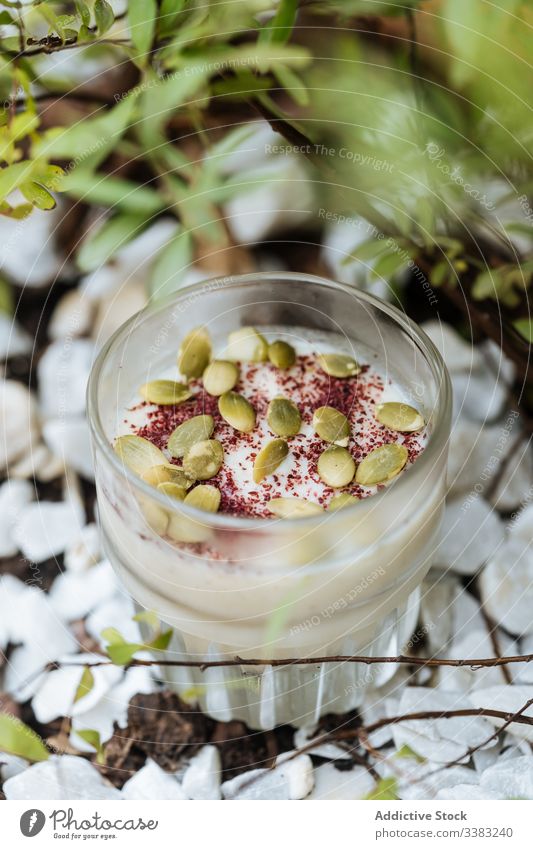 Delicious dessert with seeds in cup creamy sweet cinnamon glass delicious fresh ice cream yummy gourmet sugar ingredient festive confectionery calorie milk
