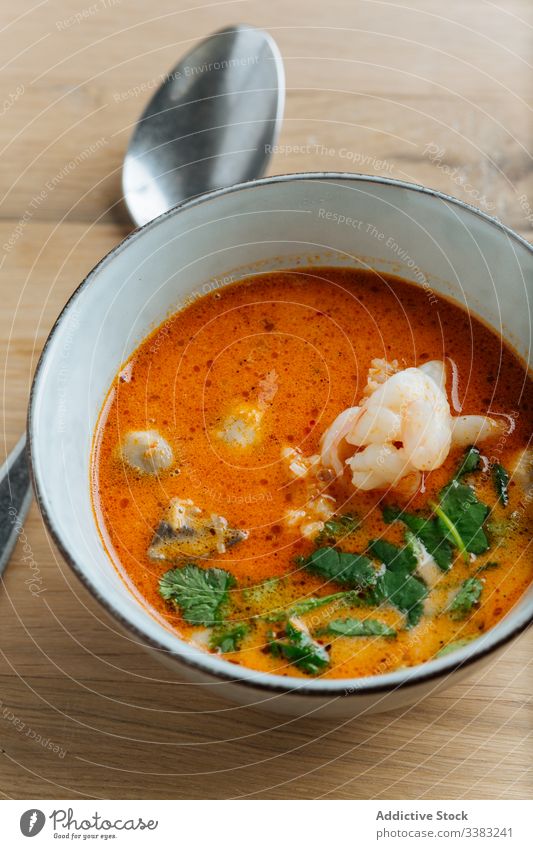 Traditional Asian tom yum with shrimps in restaurant soup seafood high cuisine asian food spoon dish meal delicious organic lunch tradition nutrition hot