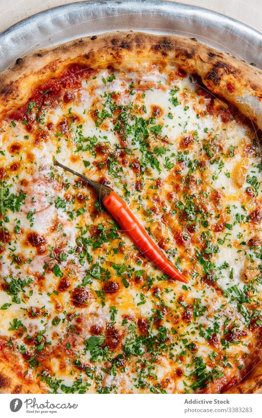 Juicy pizza with cheese and chopped oregano delicious cafe cayenne pepper new york style sauce baked parsley tomato simple spicy green savory crust herb