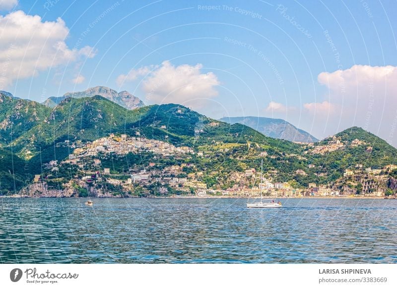 Panoramic view of small haven of Amalfi village with turquoise sea and colorful houses on slopes of Amalfi Coast with Gulf of Salerno, Campania, Italy. amalfi