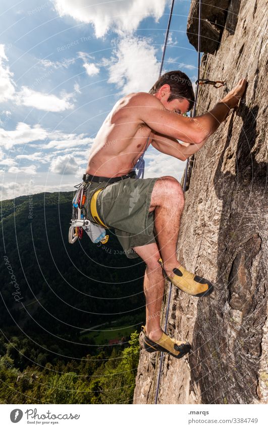 climber Sports Climbing Free climber Sky peril Clouds free torso Wall of rock Brave Man Trust Safety Joy Steep Muscular Effort Rock Mountaineering