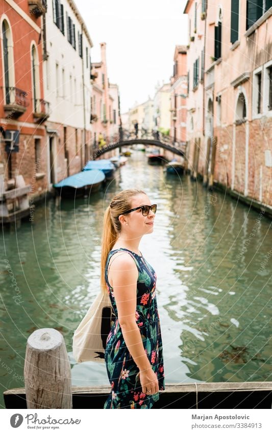 Young female traveler enjoying in Venice, Italy architecture attraction blogger boat bridge building canal casual caucasian city cityscape day europe european