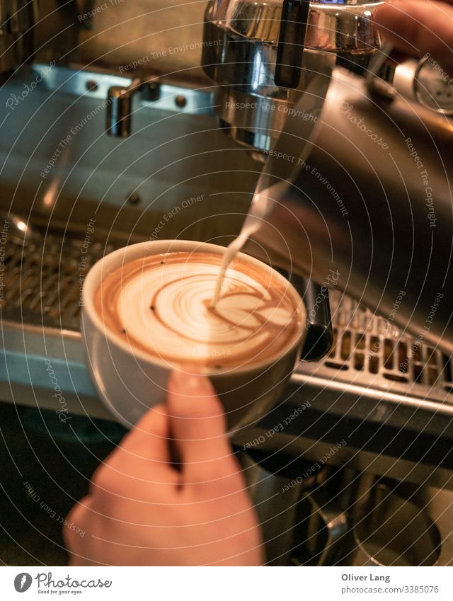 Milk Pouring Latte Art into Coffee Cup coffee latte beverage Hot cafe latte cup espresso based coffee cup coffee shop double espresso latte art hot drink