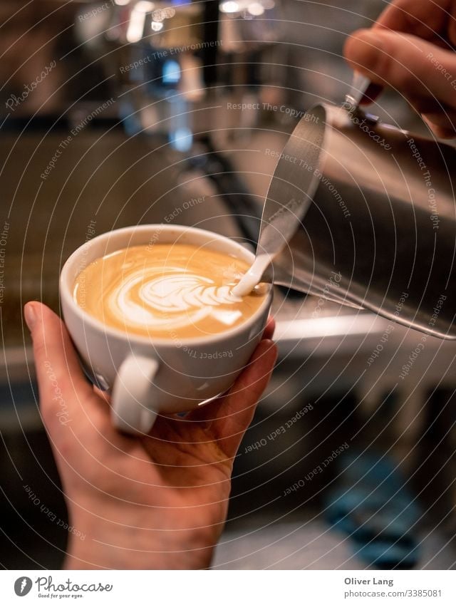 Milk Pouring Latte Art into Espresso barista espresso hot drink latte art coffee making Café Café au lait double espresso cup espresso based coffee cup