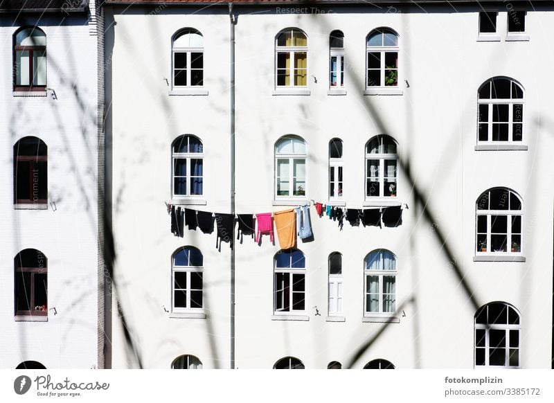 Clothesline on house front clothesline Laundry house facade Washing Old building Apartment house Washing day Window Household Dry Hang up hanging up laundry