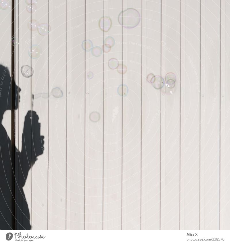 Bubbles* Playing Human being Feminine Child Woman Adults 1 Wind Flying Soap bubble Blow Shadow play Colour photo Exterior shot Deserted Copy Space right
